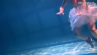 Bulava Lozhkova In Red Dress And Tie Diving Underwater